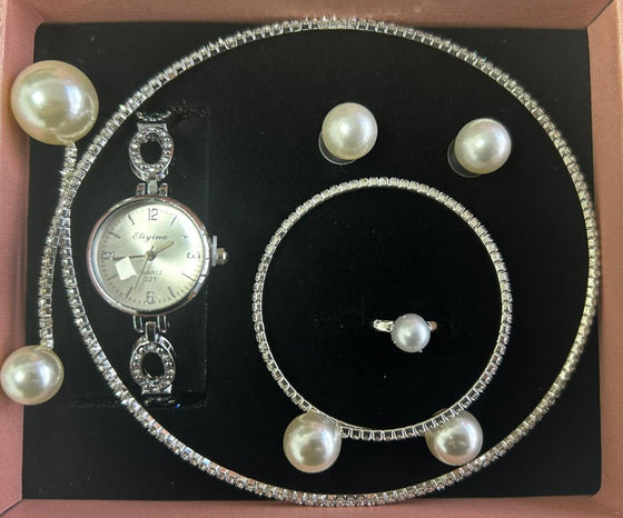 conjunto de joyas plateado con perlas